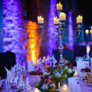 Elegant candlelight dinner table by night