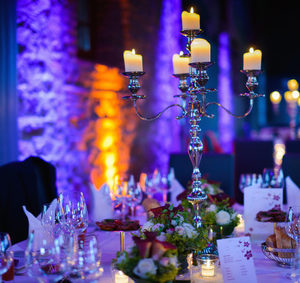 Elegant candlelight dinner table by night